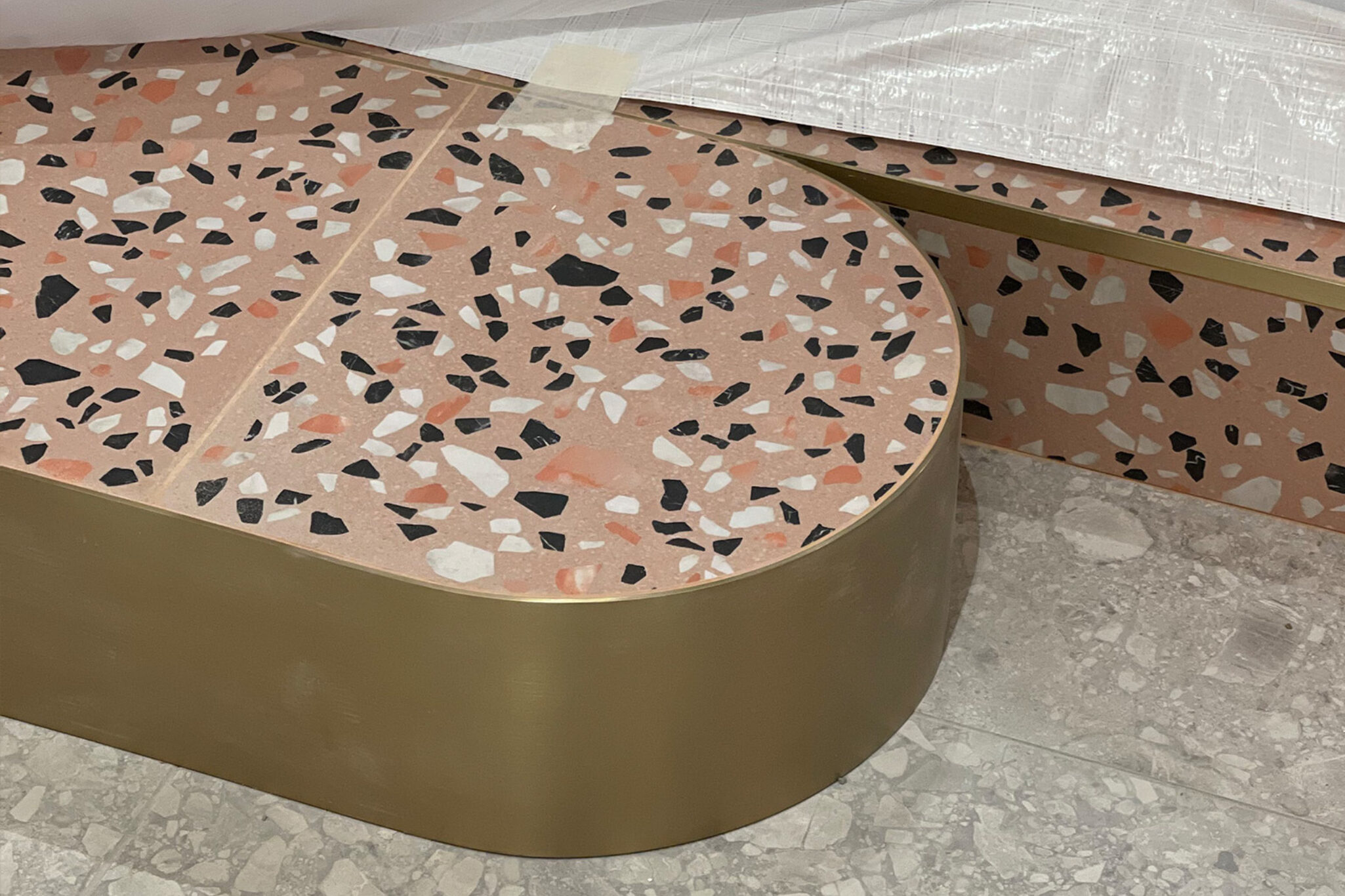 A close-up shot of granite pieces placed on the floor, as part of an on-site management project by Studio X