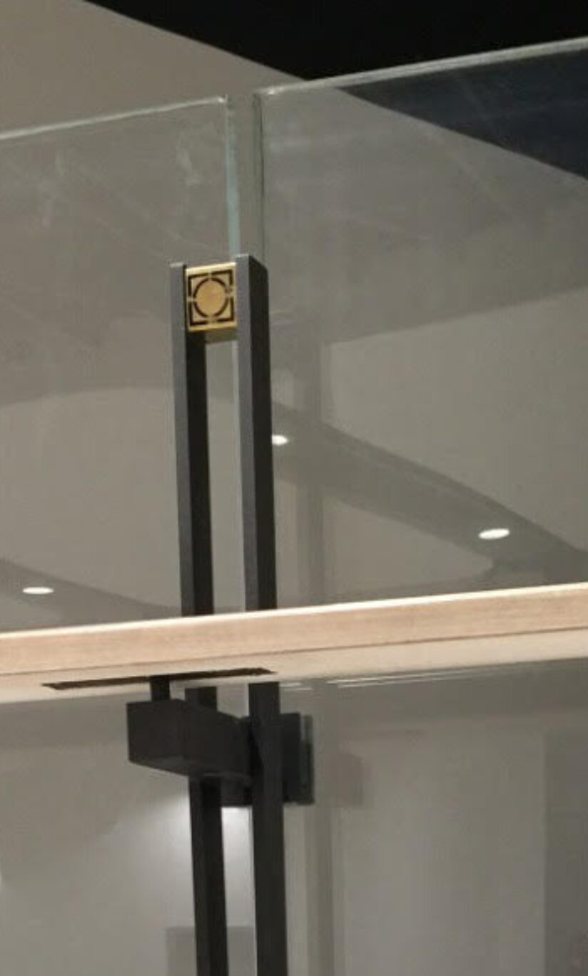 A closeup shot of the Interior glass railings or centre glass bar cabinet, showing details of the design project by Studio X