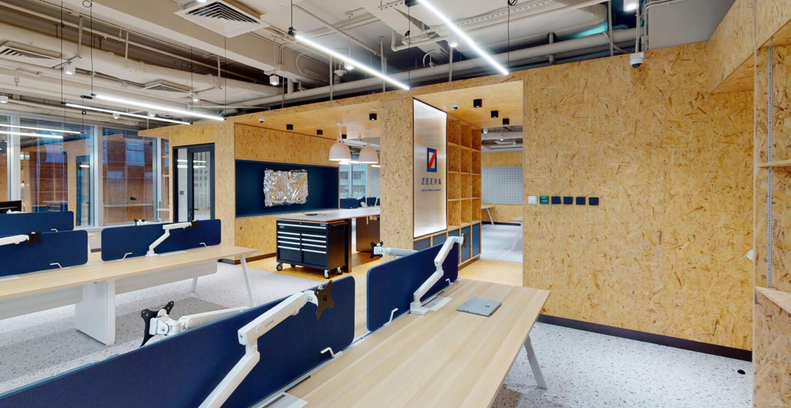 A wide-angle shot of the redesigned corporate workplace, looking neat and spacious, after Studio X's redesign