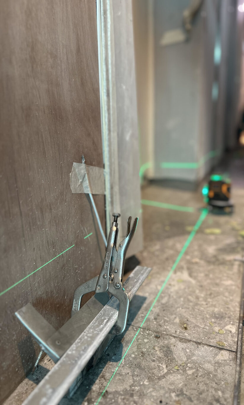 A close-up shot of welding and repair work in progress in a building, part of a design project by Studio X