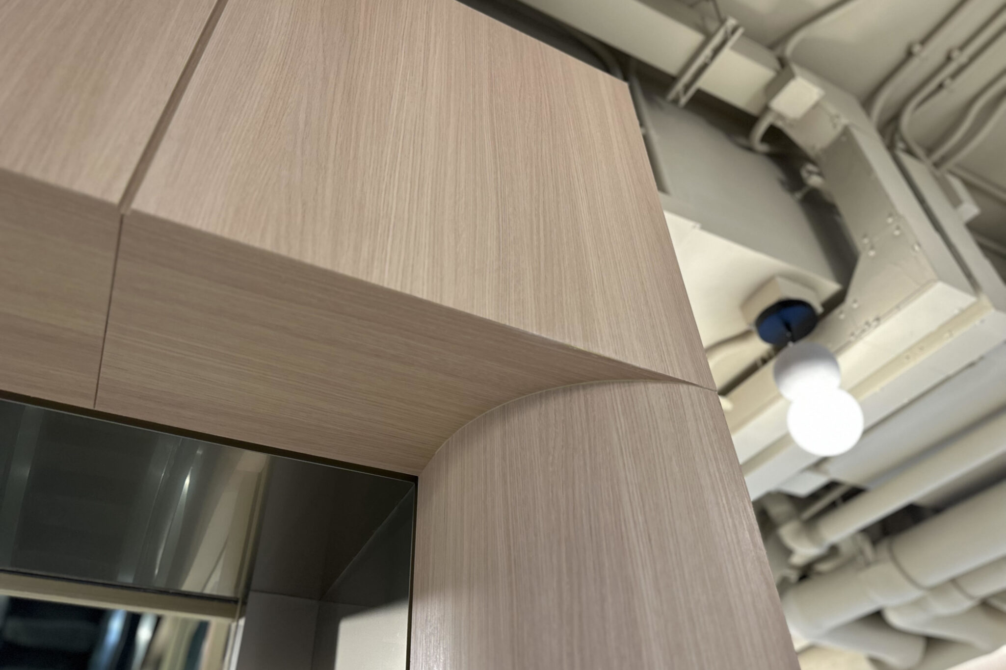 Low-angle view of the elegantly designed Yau Shing commercial centre by Studio X professionals